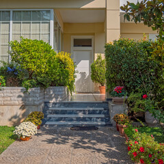 Poster - contemporary house front and entrance door by the sidewalk, Athens Greece.