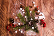 red viburnum. Christmas cones and branches on wooden boards with marshmallows
