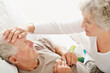 © momentimages/Tetra Images - Senior woman caring for man with a fever