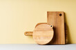 © Anastasia Nurullina/ADDICTIVE STOCK - Wooden cutting boards of various shapes on bright studio background