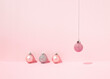 © Dani Enamorado/ADDICTIVE STOCK - From above of decorative Christmas baubles arranged on pink background in studio for holiday celebration