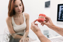 Dentist's Hand With Classic Orthodontics