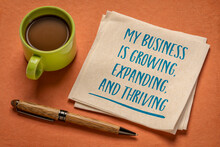 My Business Is Growing, Expanding, And Thriving - Handwriting On A Napkin With A Cup Of Coffee, Positive Affirmation For Business Owners