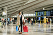 © Manuel Ruiz Alba/ADDICTIVE STOCK - Man with dark hair in stylish clothes walking with suitcase in terminal of airport