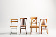 © Txema Gerardo/ADDICTIVE STOCK - Four classical wooden chairs against white background
