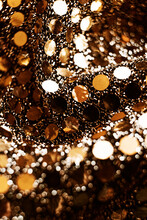 Closeup Of Sparkling Textured Surface With Shiny Golden Round Sequins For Festive Background