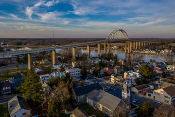 Canvas Print - Aerial panorama of Chesapeake City Maryland historic fishing town on the Chesapeake Delaware canal with private boats docked in the marina and the Chesapeake City Bridge over the back creek