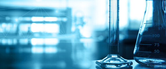Wall Mural - flask and cylinder in medical science lab blue banner background