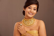 Beautiful Indian young women portrait with Indian traditional jewelry studio shot.