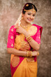 © krishna - Beautiful smiling Indian bride with jewelry in studio shot.