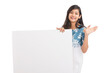 © krishna - Cheerful attractive young women holding white board on white background.