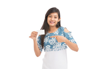 Wall Mural - Attractive happy young women holding business card on white.