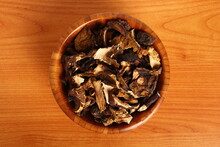 Dried Mushrooms In Wooden Bowl. Boletus Badius.