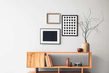 Shelving unit with books and decor in interior of room