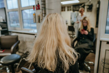 Young Woman Sitting In A Chair In A Beauty Salon