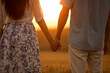 © Blue Jean Images - Happy young couple having fun in wheat field