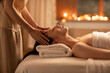 © Blue Jean Images - Young woman receiving facial massage at spa center