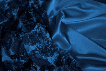 Wall Mural - Blue silk satin fabric background. Elegant navy blue background with copy space for your design.