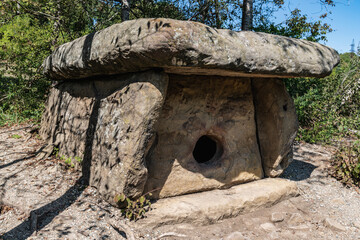 Wall Mural - A large stone dolmen with a round entrance