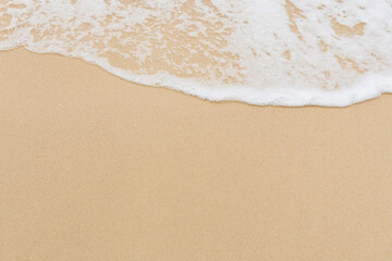 Soft wave of sea on empty sandy beach Background with copy space