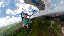 Unique Images Of A Parachutist Making Selfie. Used A Special Camera With Fish Eye Lens. Artistic And Deformed Images In The Background.