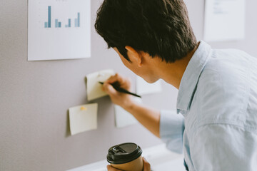 Wall Mural - Asian businessman are thinking about growth plans