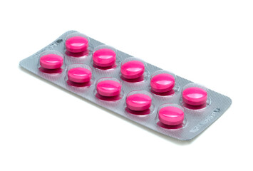 blister pack of pink tablets pill isolated on white background