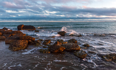 Colorful sunrise on the rocky coast