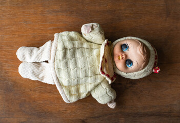 Wall Mural - Vintage doll on a wooden table