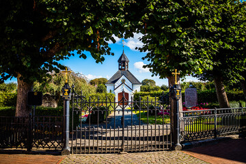 Wall Mural - Historic cemetary of Holm district of the town Schleswig in Schleswig-Holstein, Germany