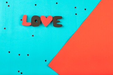 Wall Mural - Word LOVE on abstract colorful background.