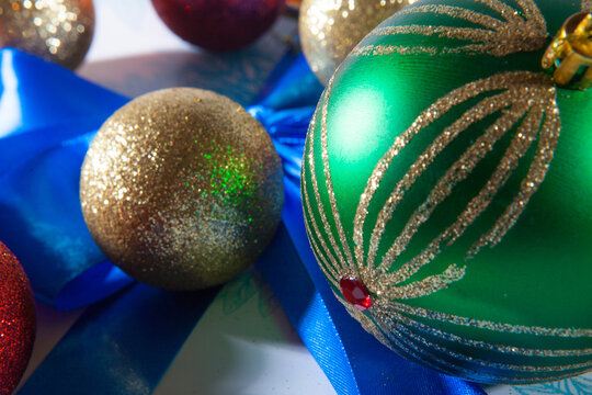 Happy Christmas. Multicolored balls on the blue white gift