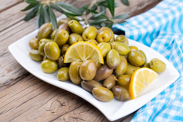 Cracked green olives. Cracked green olives with lemon. Turkish style olive (Turkish name; kirma zeytin)