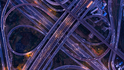 Wall Mural - Aerial top view expressway transport traffic road with vehicle movement logistic, Interchange expressway is an important infrastructure, Junction crossing road architecture highway motorway freeway.