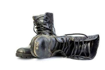 Wall Mural - Old and torn black boots. isolated on a white background