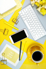 Wall Mural - 2021 colors of the year, yellow and gray, desktop workspace with keyboard, smart phone and desk accessories. Top view blog hero header creative composition flat lay.