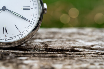 old watch on the wood. Vintage watch as a symbol of passing time. Concept on the theme of history, nostalgia, old age. close-up shot