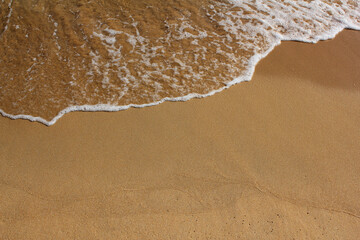 Wall Mural - close up Sand beach and spume.