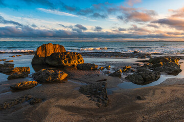 Wall Mural - Colorful sunrise on the rocky coast