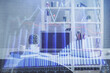 © peshkova - Double exposure of financial graph drawing and office interior background. Concept of stock market.