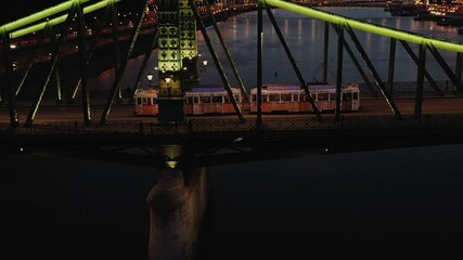 Wall Mural - 4k Video about the christmas light decorated tram in the Liberty bridge Budapest, Hungary. This tram works only christmas time every year. Amazing tourist attraction. 