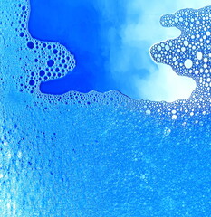 Wall Mural - Foam blue texture soap bubbles on the water abstract background