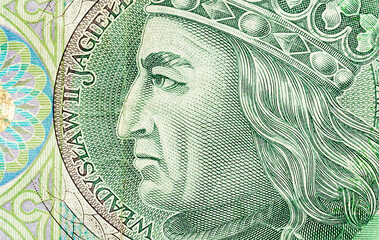 Polish currency, PLN, 100 zł, one hundred zloty bill macro, extreme closeup detail Władysław II Jagiełło face on a bank note top view, from above, banknote