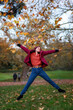 © Gennaro Leonardi - She girl jumps in the autumn nature foliage.