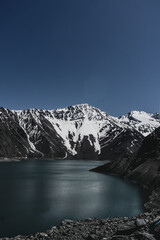 Canvas Print - Impressive vertical photo of the Embalse El Yeso, located in San Jose de Maipo known as El Cajon del Maipo in the Andes Mountains, Chilean Patagonia