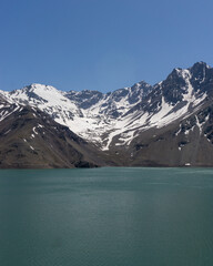 Impressive vertical photo of the Embalse El Yeso, located in San Jose de Maipo known as El Cajon del Maipo in the Andes Mountains, Chilean Patagonia