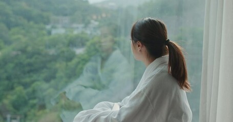 Sticker - Woman wear bathrobe and look outside window