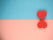 two red hearts on blue and pink background