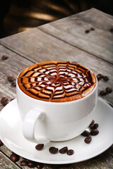 hot beverage coffee cappuccino wooden background with coffee beans 