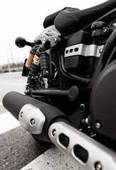 Wall Mural - A vertical shot of a black sport motorcycle parked outdoors